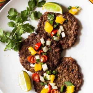 Mexican Pacholas, Mexican meat patties topped with salsa.