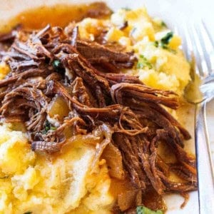 Crock pot coca cola brisket, shredded and served over mashed potatoes.
