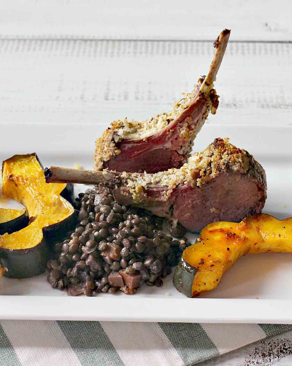 Pistachio crusted lamb chops with lentils and winter squash.