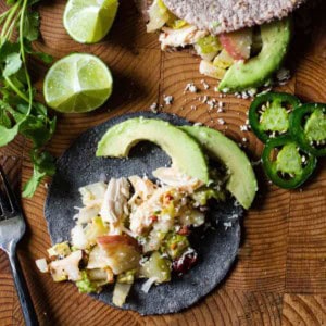 Rick Bayless rotisserie chicken tacos on homemade tortillas.