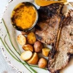 Grilled t-bone steaks served with cowboy butter.