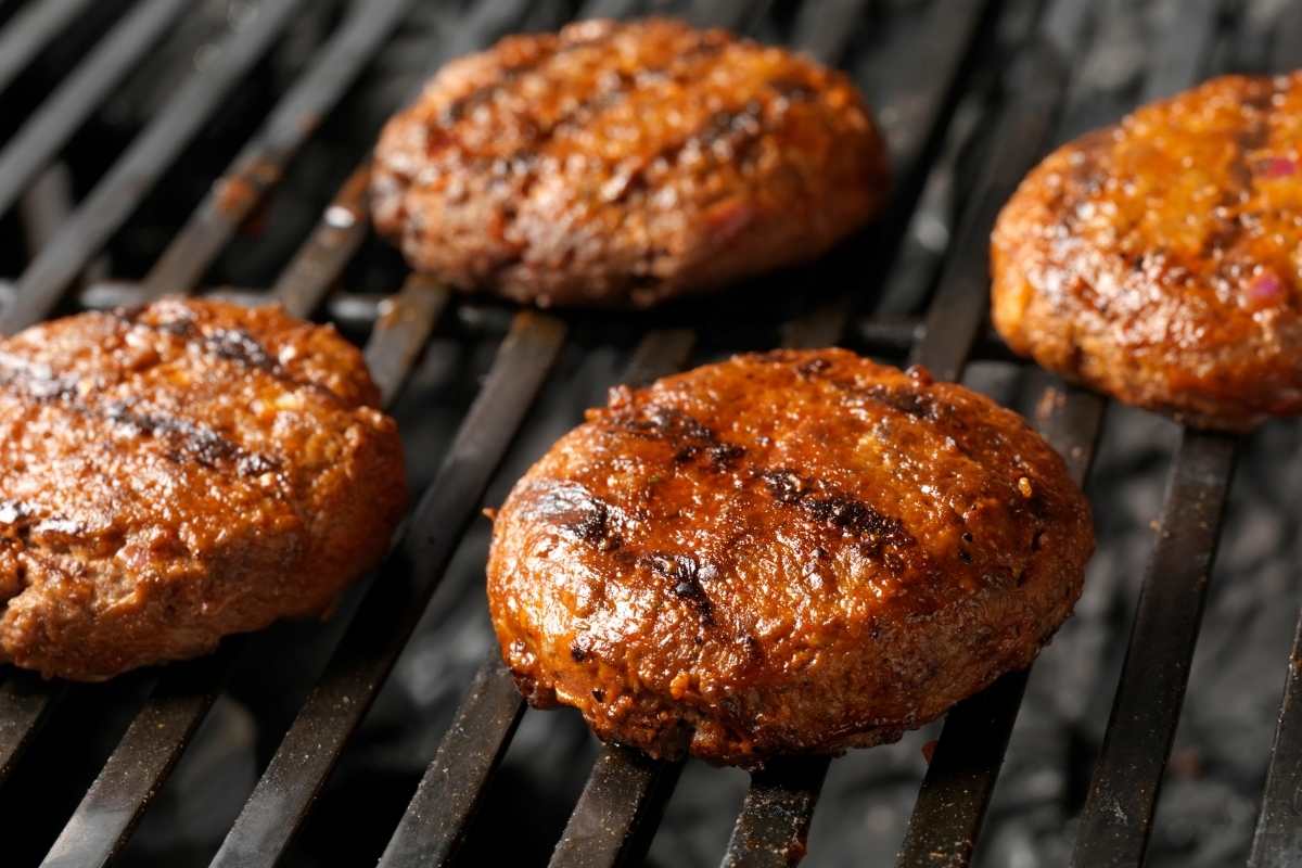 Grilling hamburger patties on a grill.