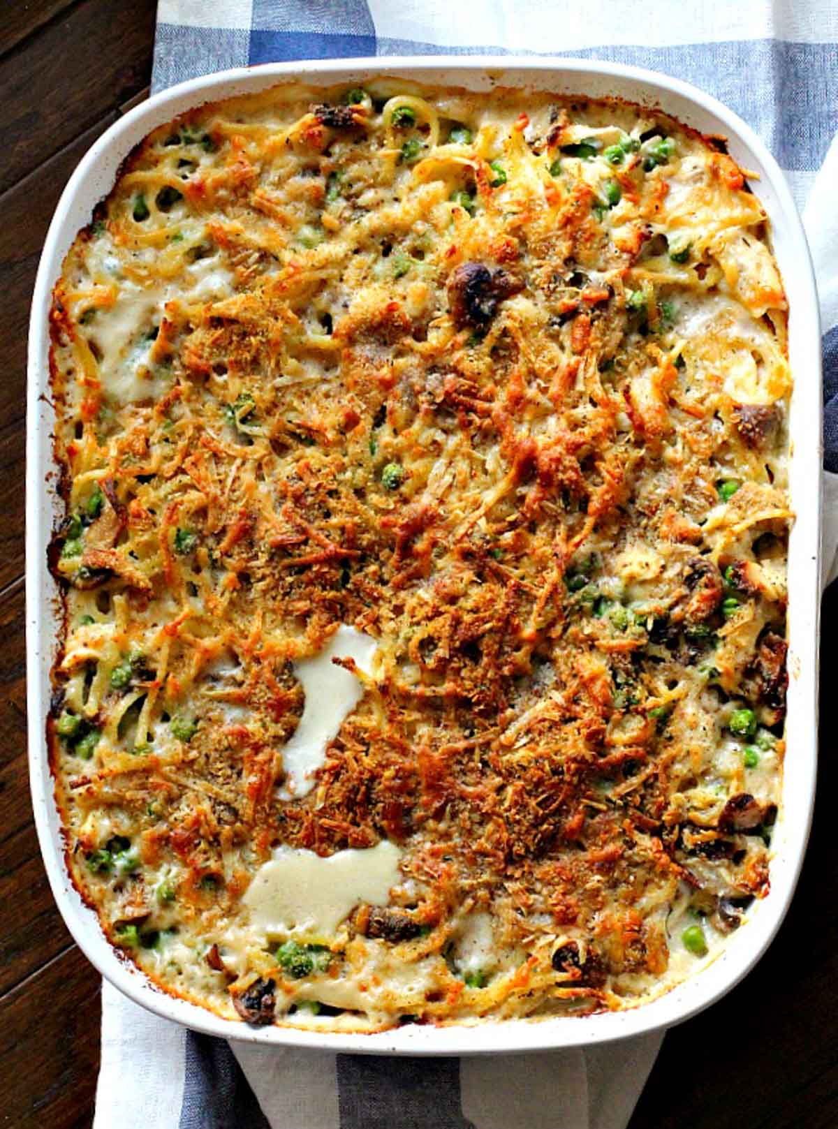 Chicken Tetrazzini casserole in a white corning casserole dish.