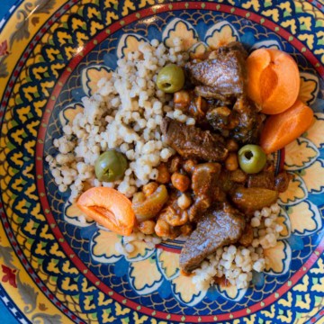 Apricot lamb tagine served in a Moroccan platter.