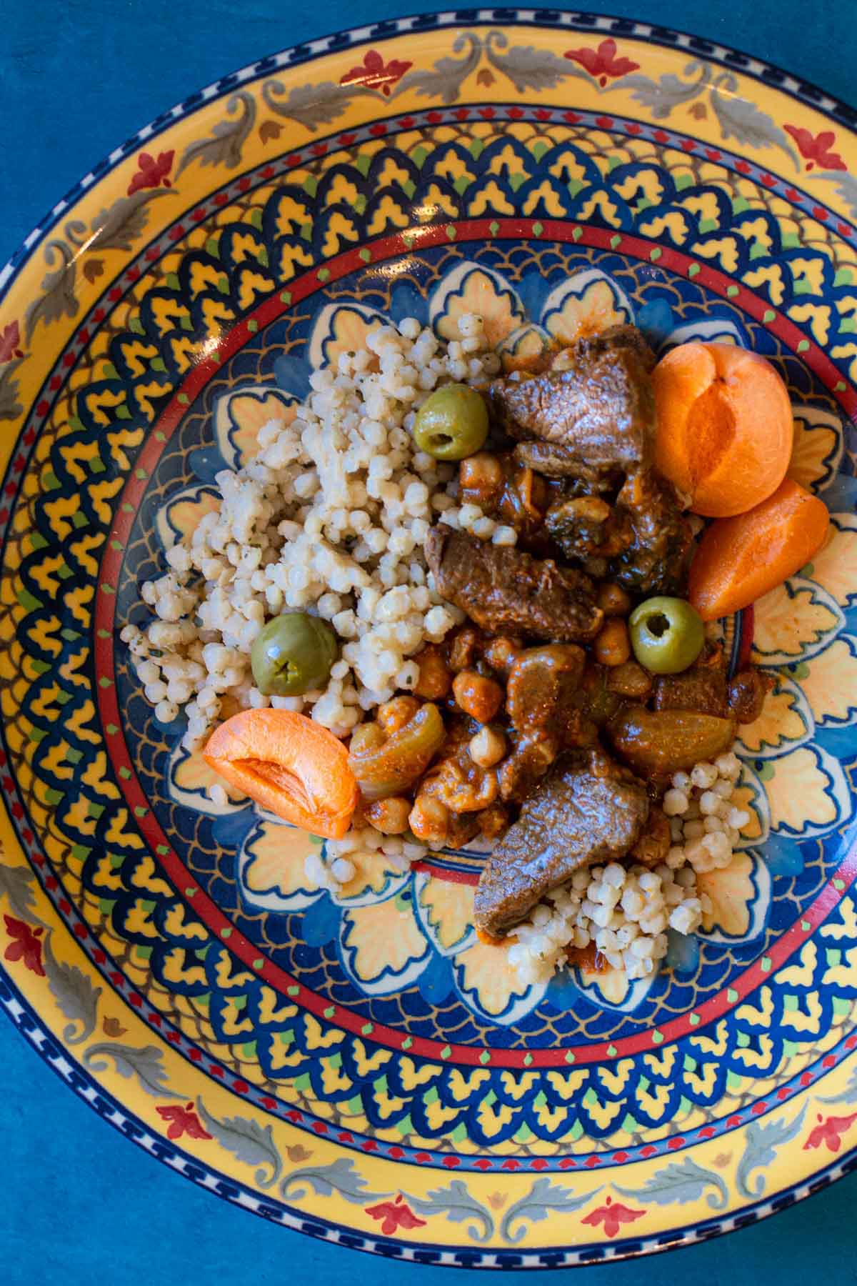 Apricot lamb tagine served in a Moroccan platter.