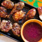 Cherry bbq sauce with grilled chicken thighs and legs.