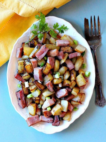 Home fried potatoes with ham and green onions.
