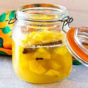 Pickled pineapple in a storage jar.