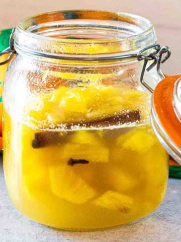 Pickled pineapple in a storage jar.