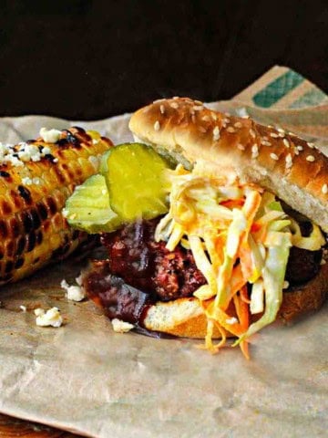 Bobby Flay's Slaw Burgers served with grilled corn.