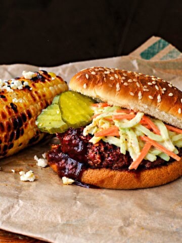 Bobby Flay's slaw burger with bbq sauce and pickles.