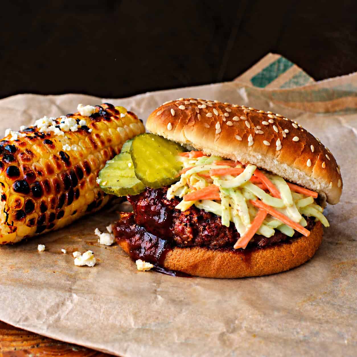 Bobby Flay's slaw burger with bbq sauce and pickles.