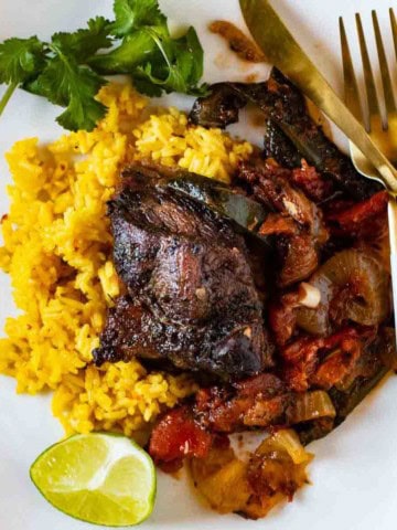 Mexican Short Ribs served over yellow rice.