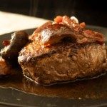 Beef Tournedos steak with red wine reduction sauce.