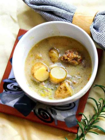 A bowl of creamy sausage potato soup.