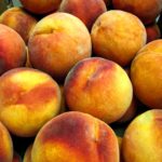 A case of fresh Colorado Palisade peaches.