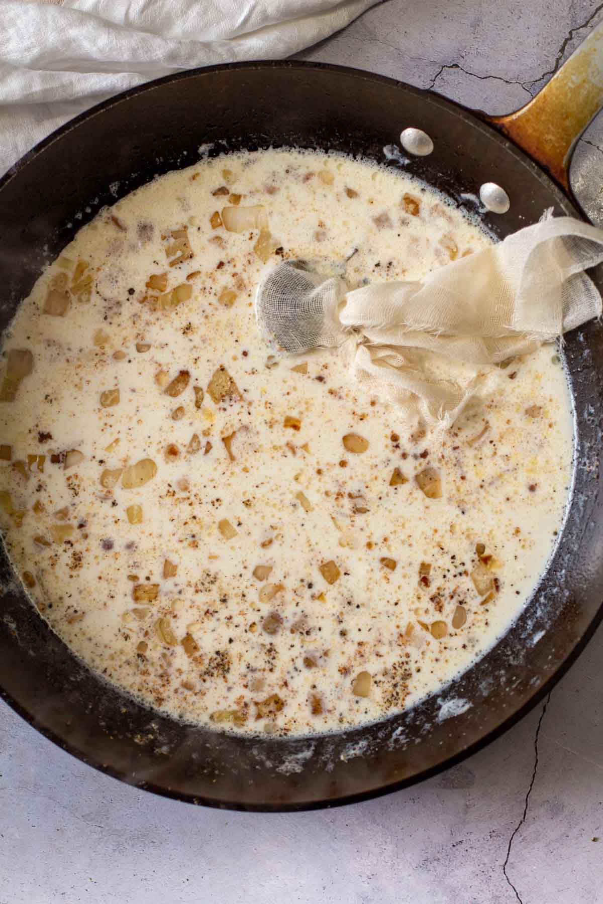 Making bachamel sauce in a large fry pan.
