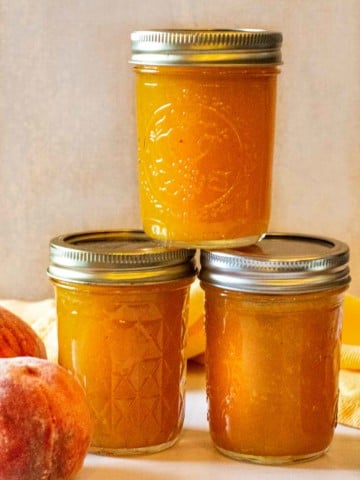 Jars of freezer peach jam.