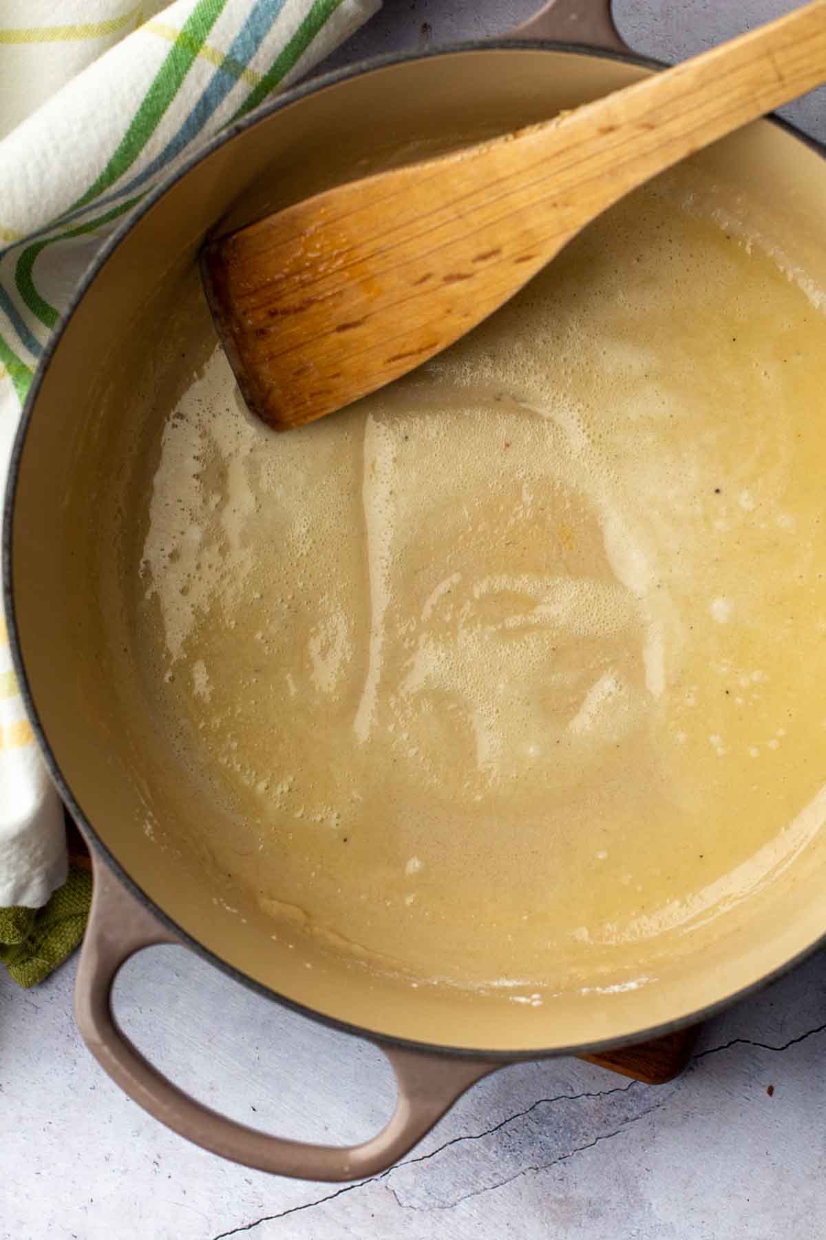 Making a roux to make white cheddar mac and cheese.