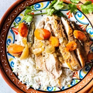 Pollo en escabeche served over white rice.