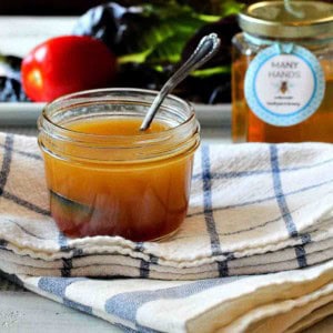 A jar of sweet red wine vinegar salad dressing.