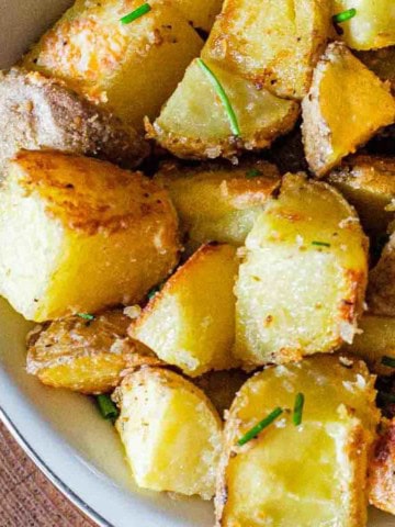 Crusted parmesan potatoes in a bowl.