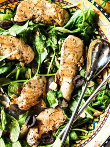 Wilted spinach salad with grilled chicken.