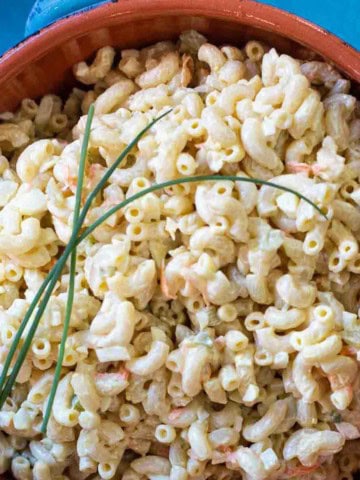 Amish Macaroni Salad garnished with chives.