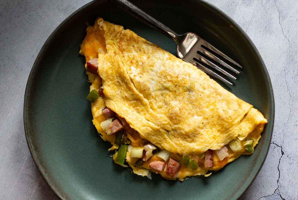 2-egg Western Omelette on a green plate.