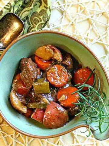 Bison stew served in a green bowl.