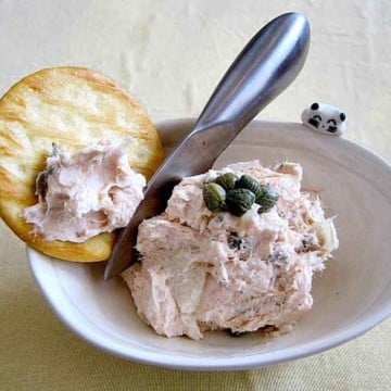Smoked salmon spread served with a cracker.