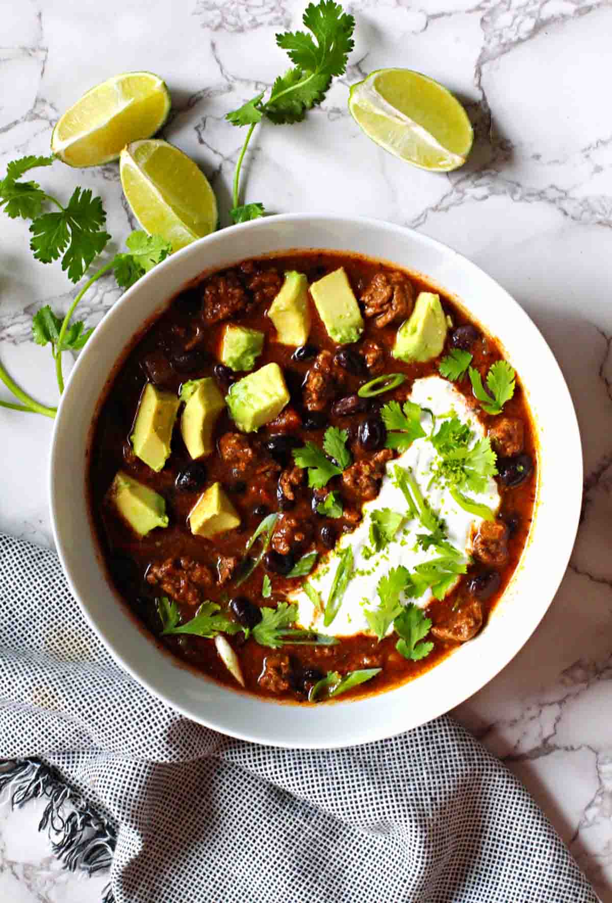 Bison Chile with Black beans topped with chopped avocado and sour cream.