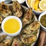 A plate of grilled artichokes with aioli.