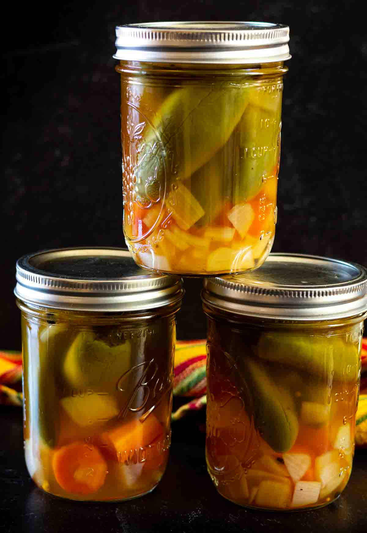 3 jars of refrigerator pickled jalapenos with carrots and onions.
