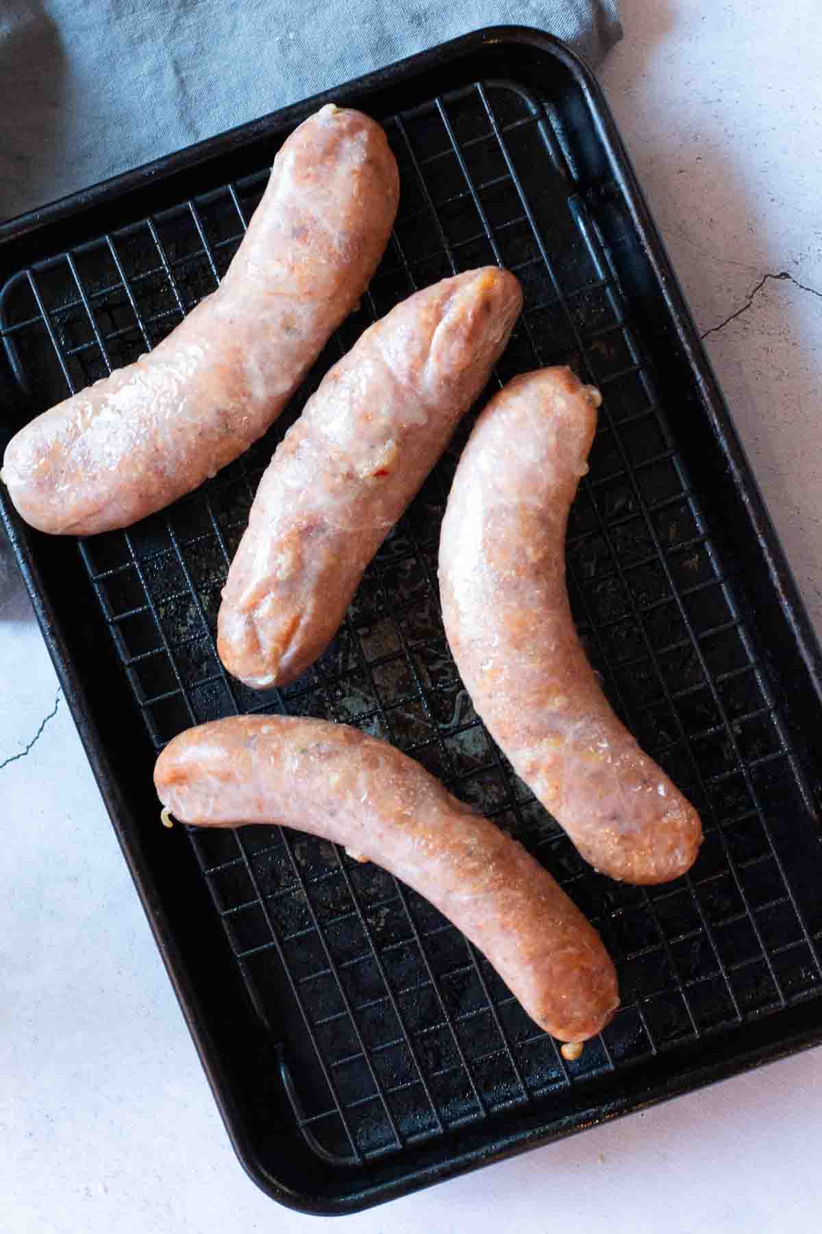 Chicken Italian Sausages on a sheet pan ready to roast.