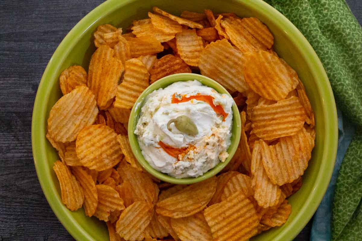 Whipped feta dip drizzled with chile oil served with bbq potato chips.