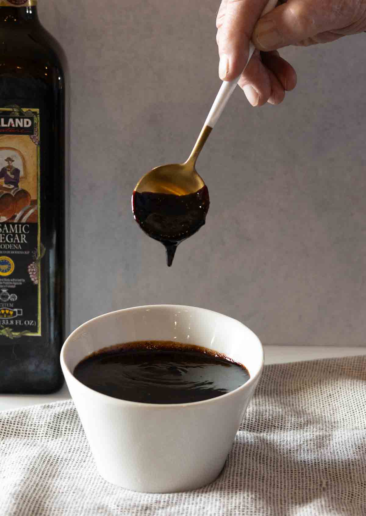 Balsamic fig glaze in a white serving bowl.