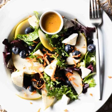 Salad with pear, blueberries, brie and champagne vinaigrette.