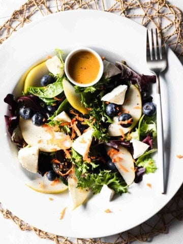 Salad with pear, blueberries, brie and champagne vinaigrette.