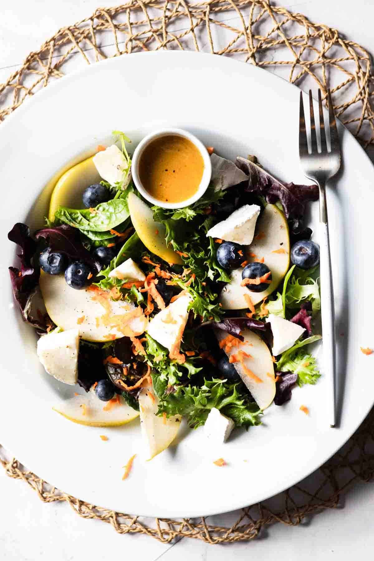 Salad with pear, blueberries, brie and champagne vinaigrette.