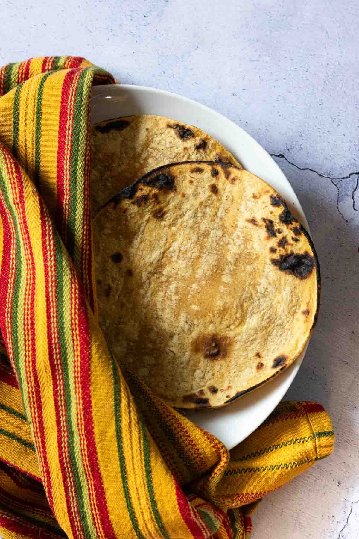 Keeping tortillas warm while making tortilla burgers.