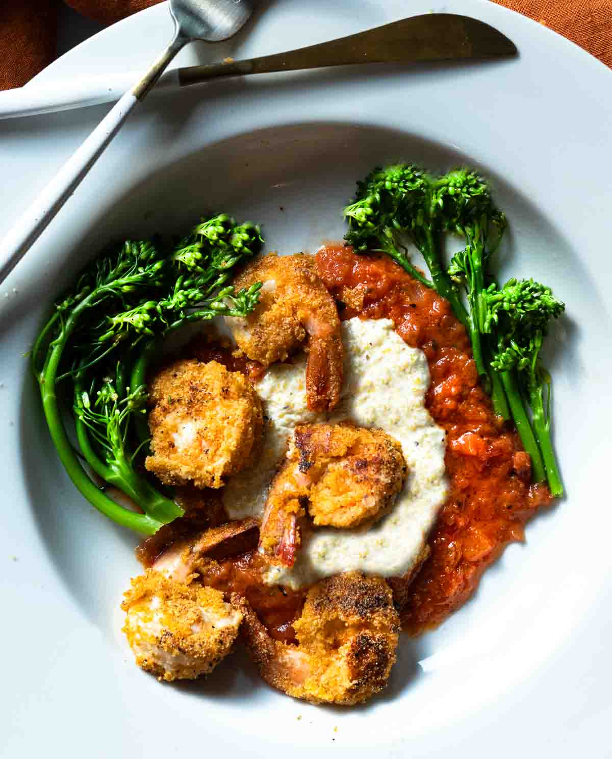 Shrimp and polenta served over marinara sauce and with baby broccoli.