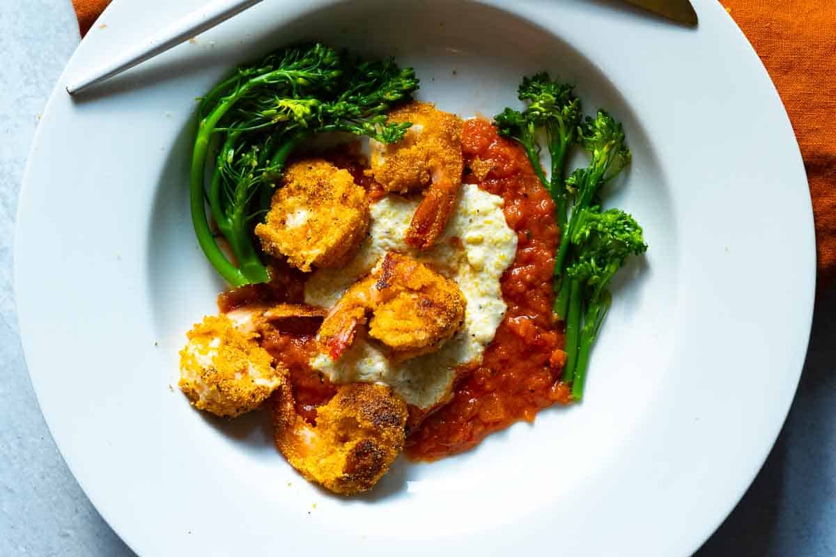 Shrimp and Polenta served over marinara sauce and baby broccoli.