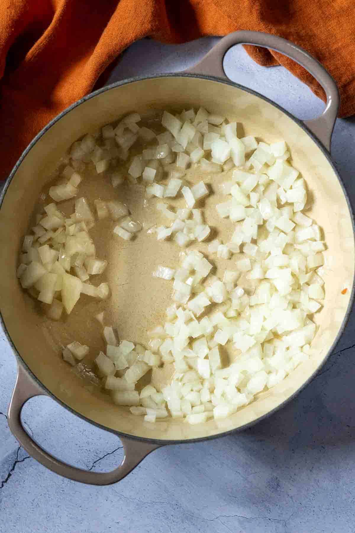 Cooking onions to make simple marinara for Shrimp and polenta.