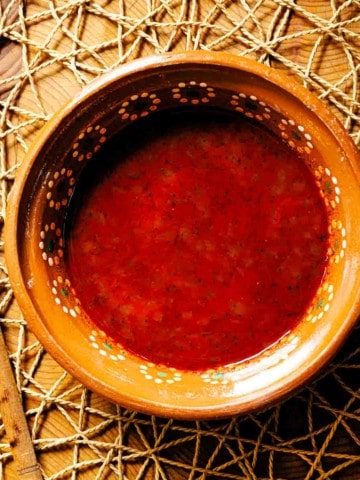 A bowl of red chile sauce made from red chile powder.