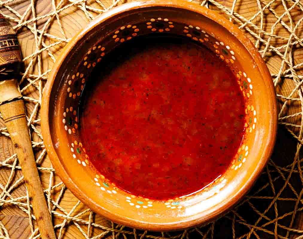 A bowl of New Mexico red chile sauce made from chile powder.
