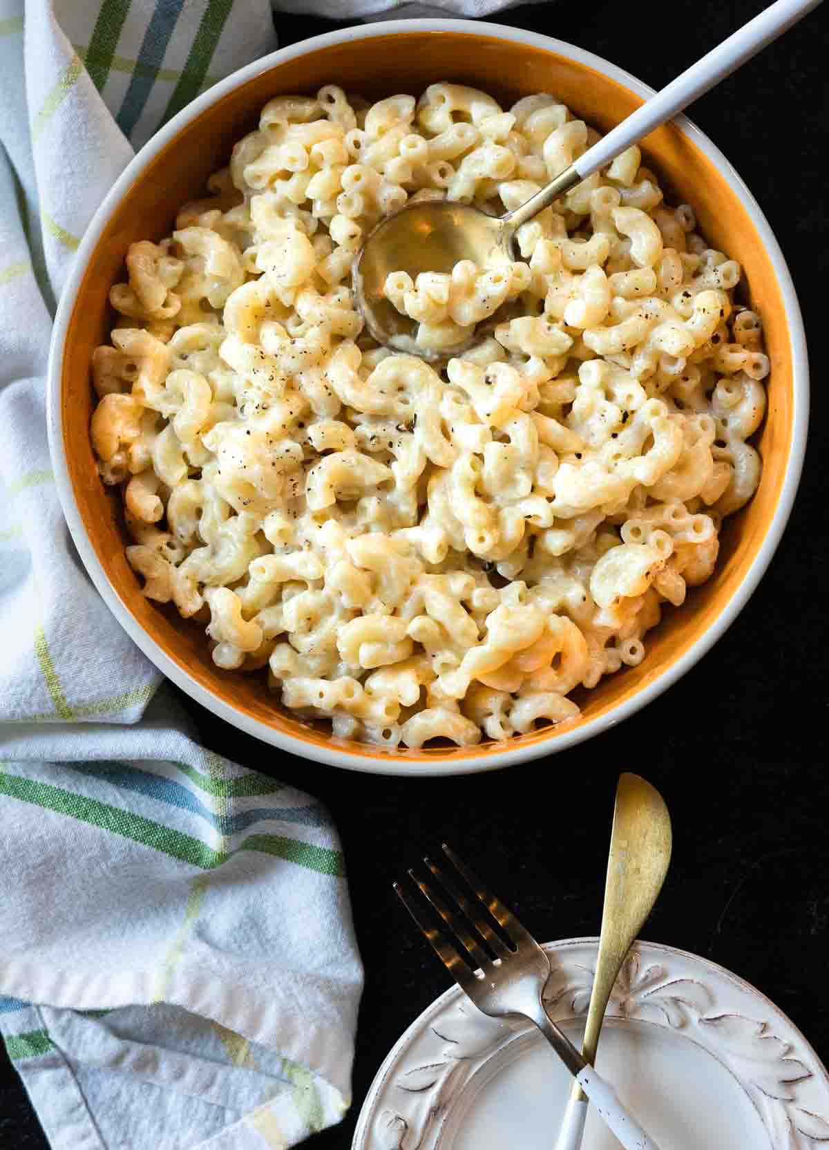 A bowl of white cheddar mac and cheese made with elbow macaroni.
