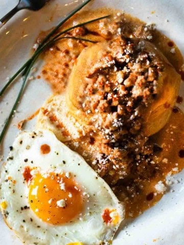 Biscuits and chorizo gravy served with a fried egg.