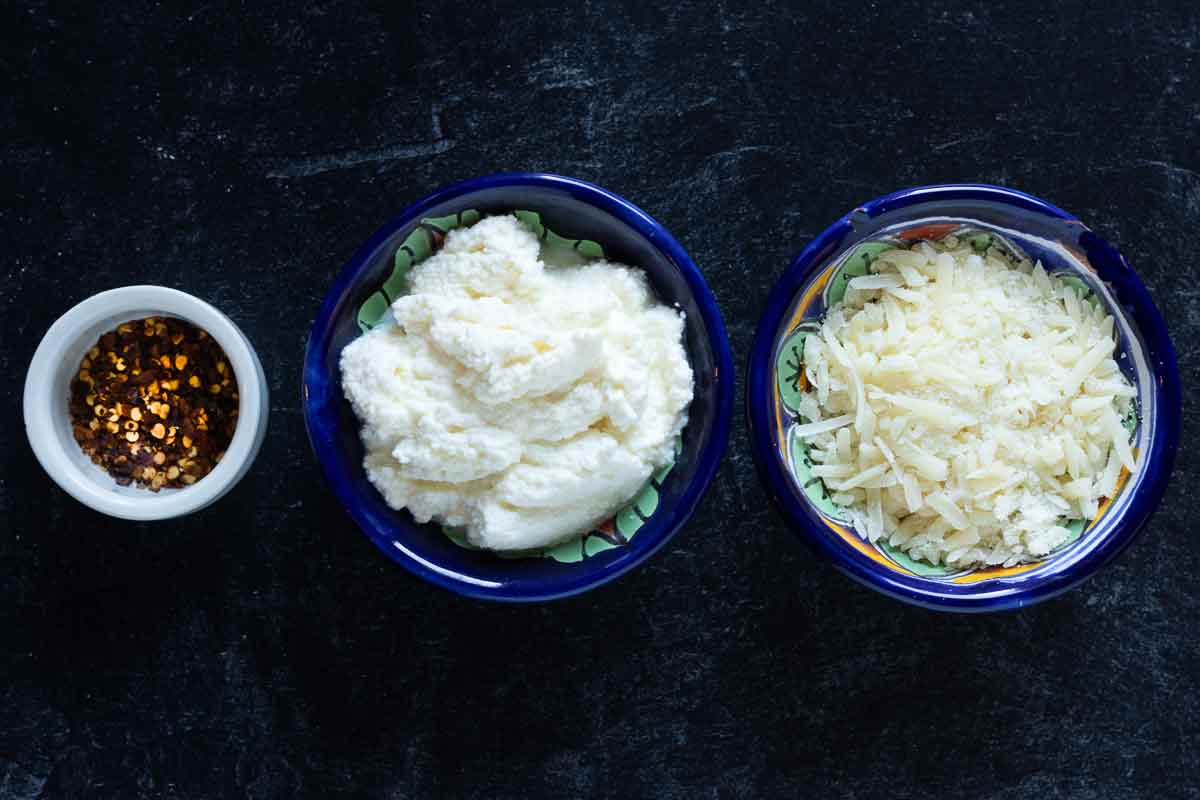Cheese toppings for lamb ragu.