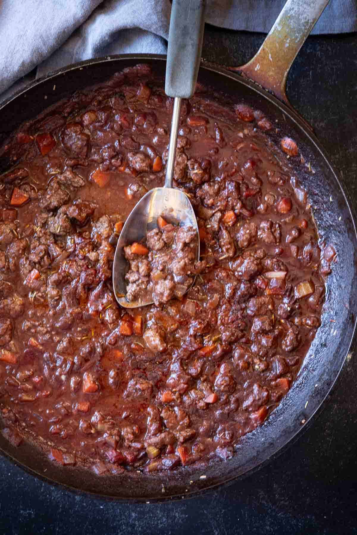 Cooked lamb ragu red sauce.